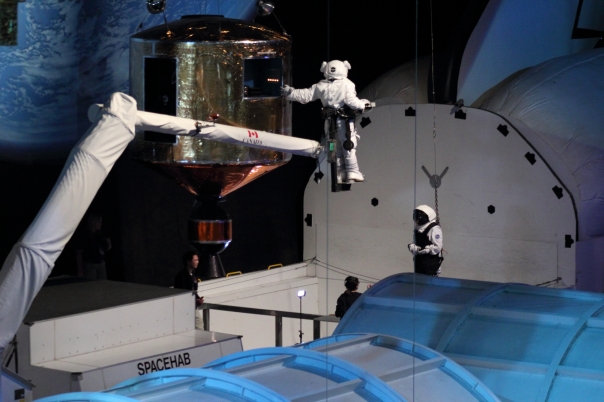 Astronaut Abby performs a simulated satellite repair on the Canadarm